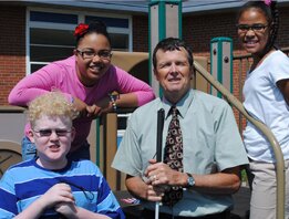 Bill Henderson with school children