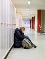 Young woman getting bullied at school